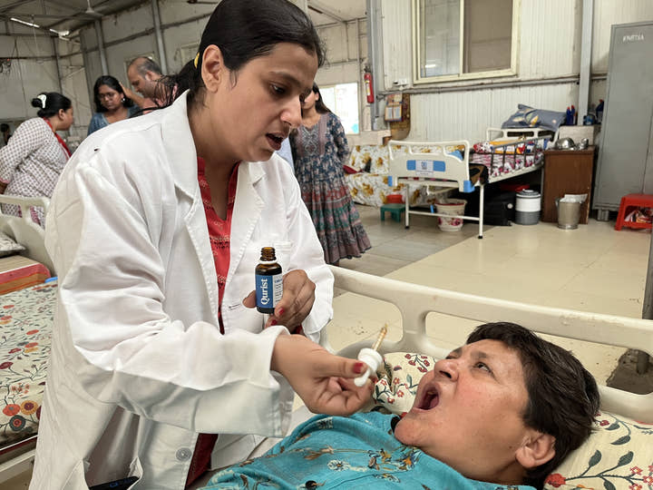 A practitioner with Qurist CBD oil at a care home ward