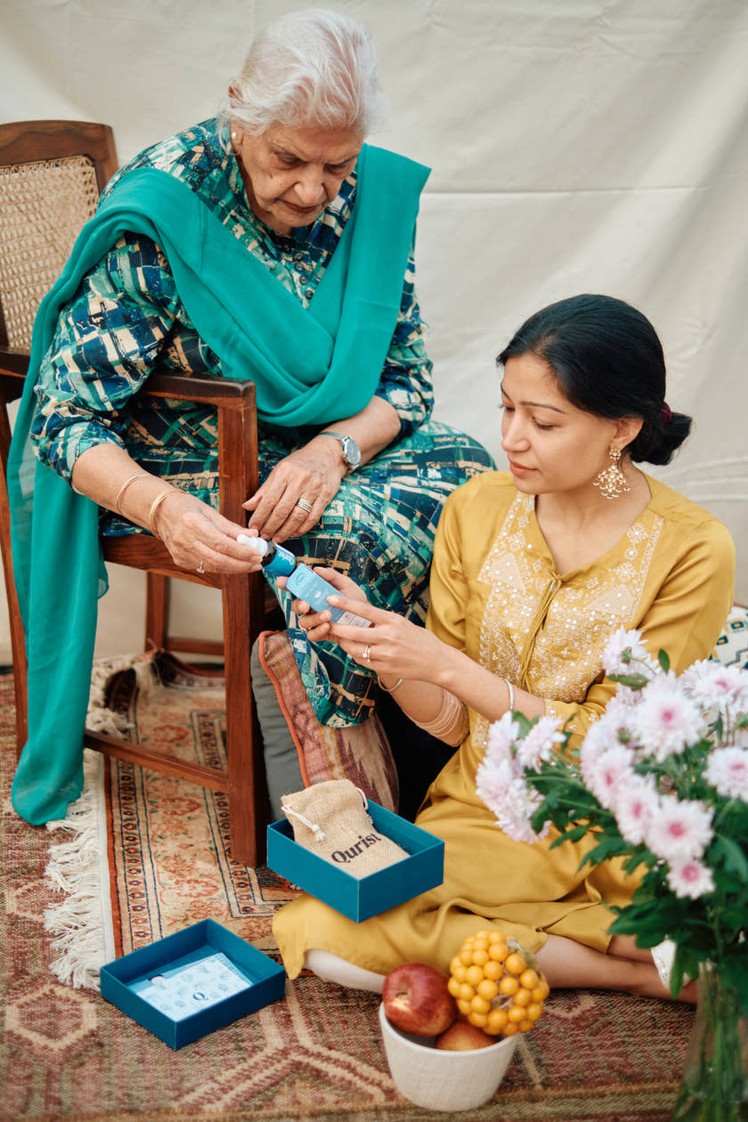 A mother and daughter looking at Qurist CBD oil together